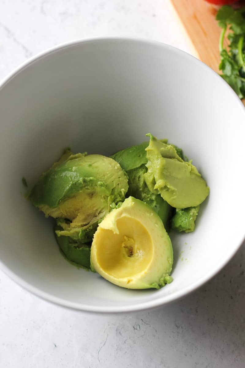 peeled avocados in the bowl
