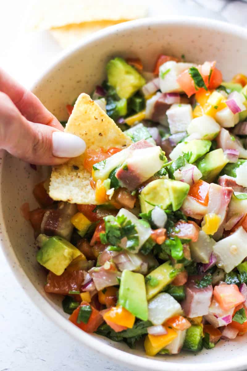 dipping chip in yellowtail ceviche