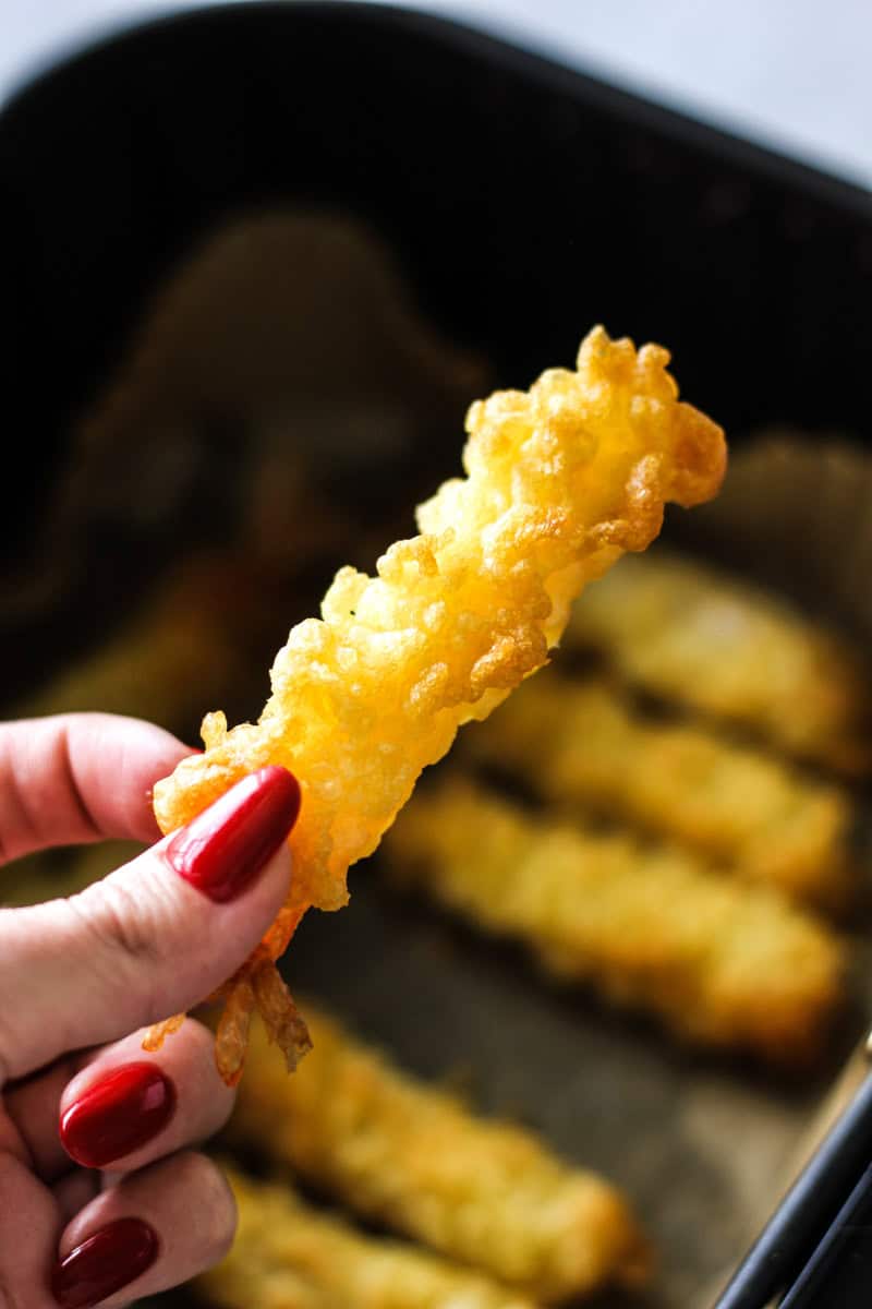 holding tempura shrimp in air fryer