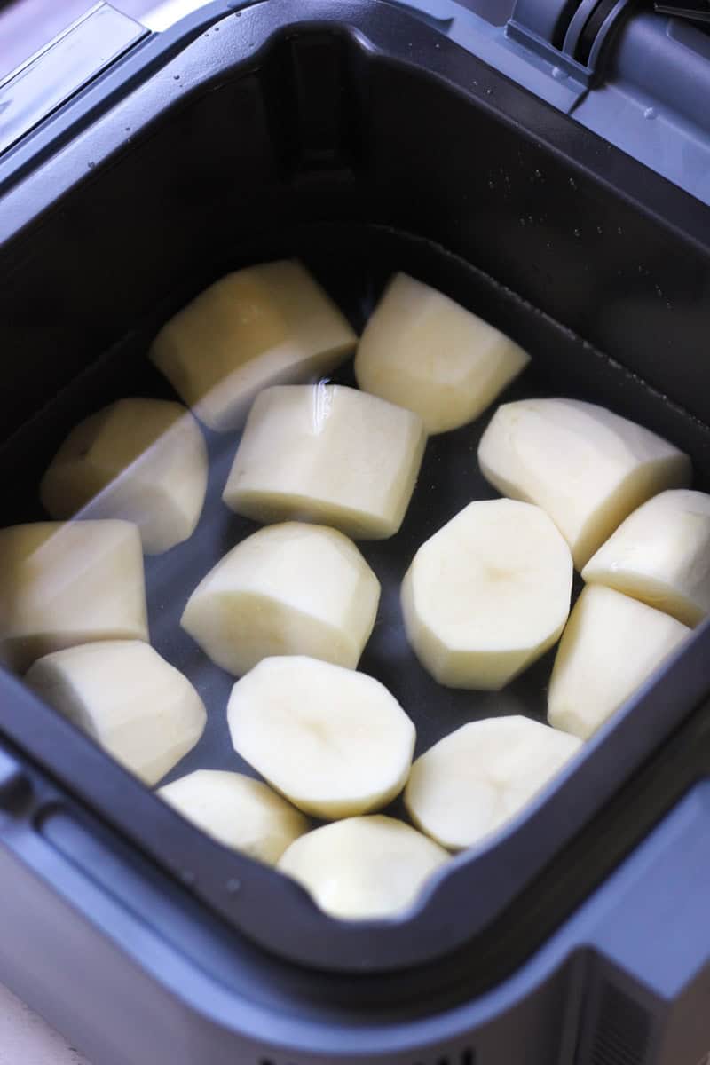 cubed potatoes in the pot