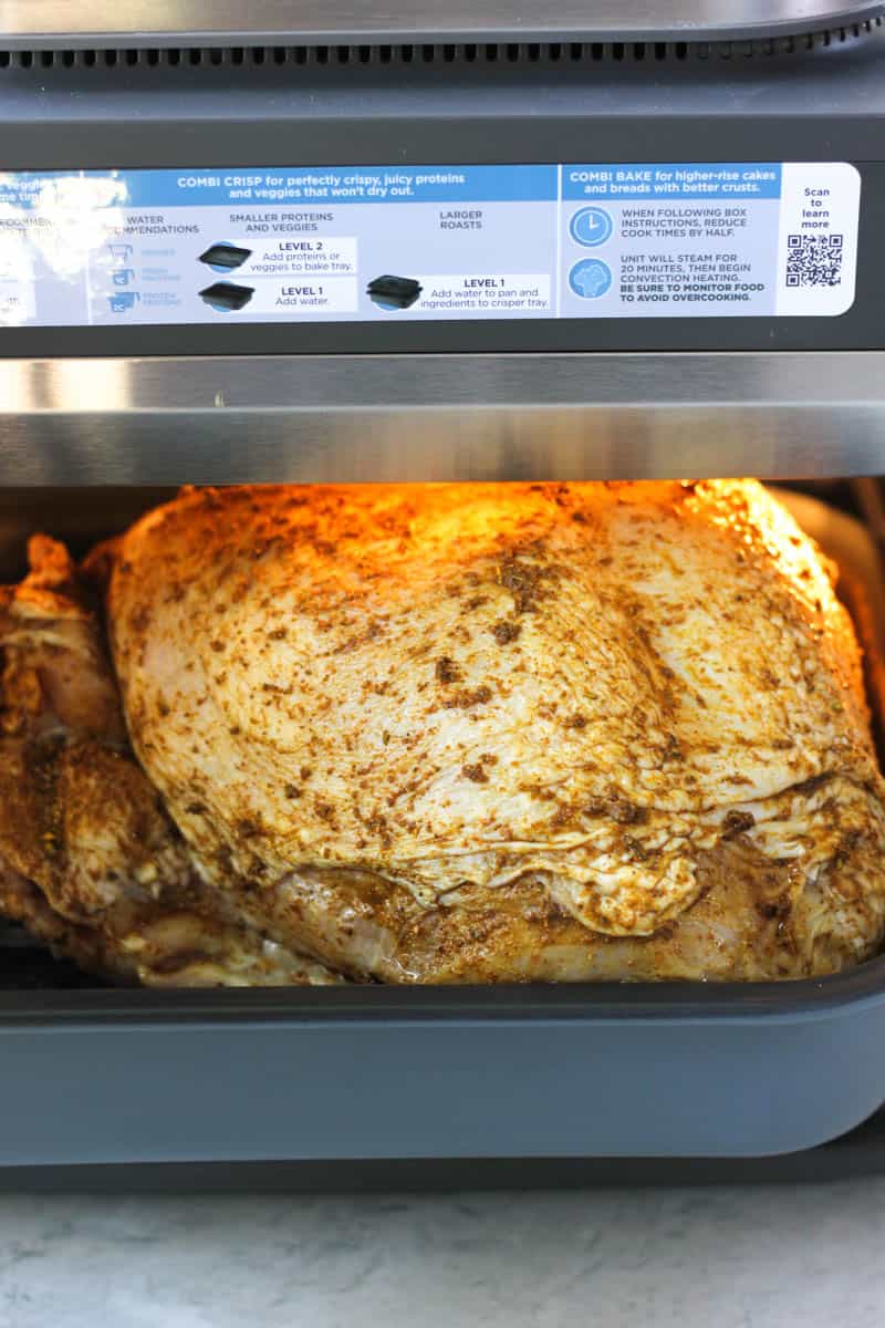 raw seasoned turkey breast in ninja combi before cooking