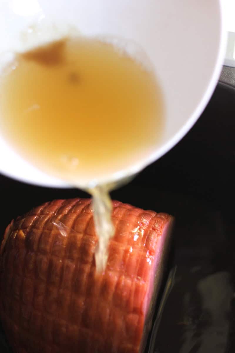 pouring juice on top of meat