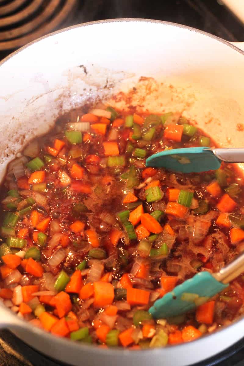 sauteed vegetables in red sauce in the pot