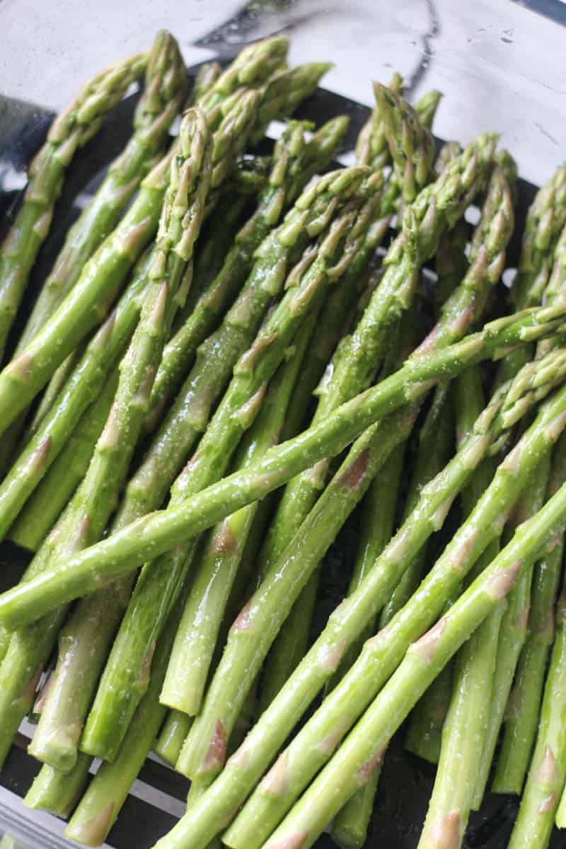 raw uncooked asparagus in the container