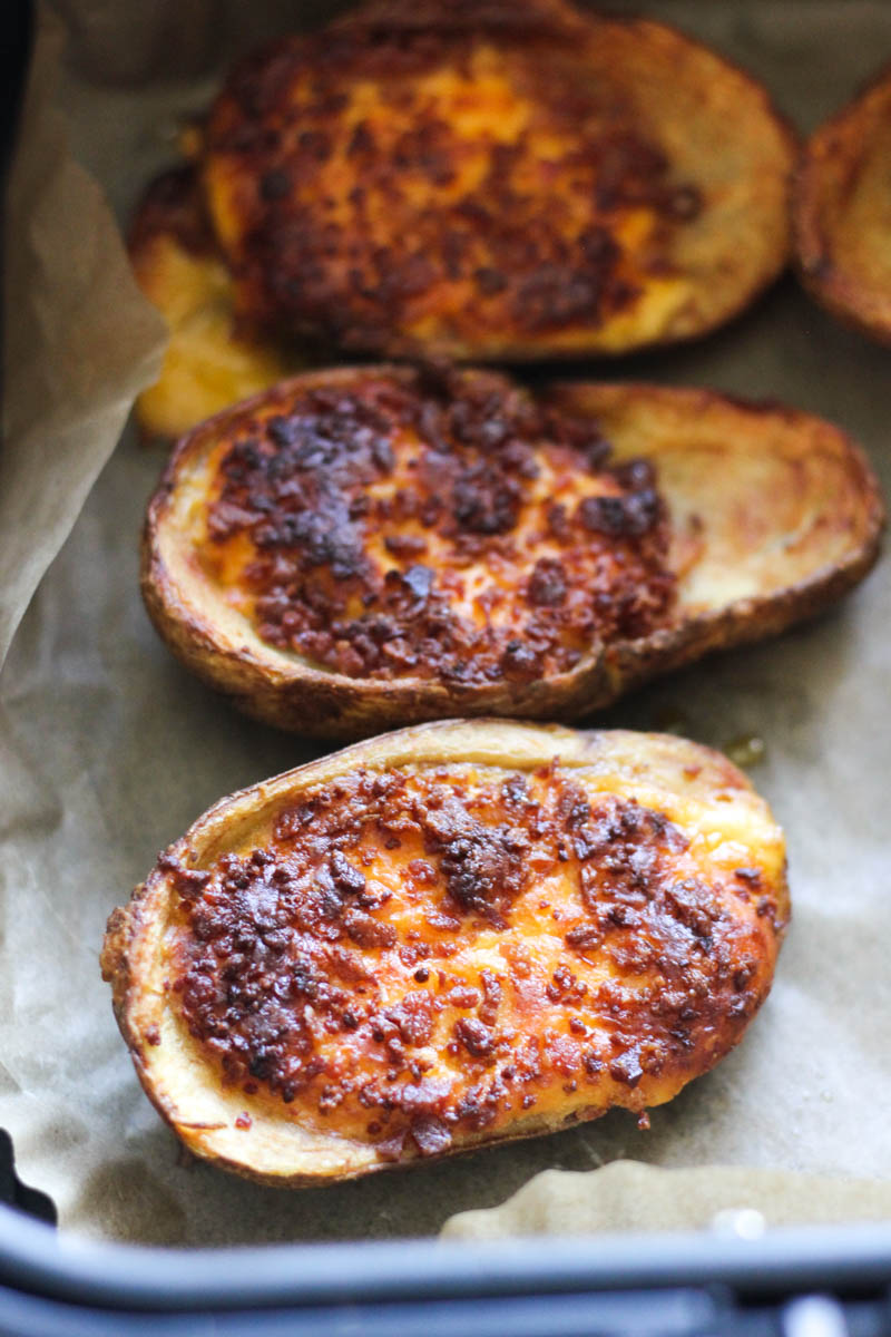 close picture of loaded potato skin in air fryer