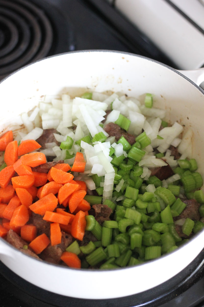 adding vegetables in to the pot