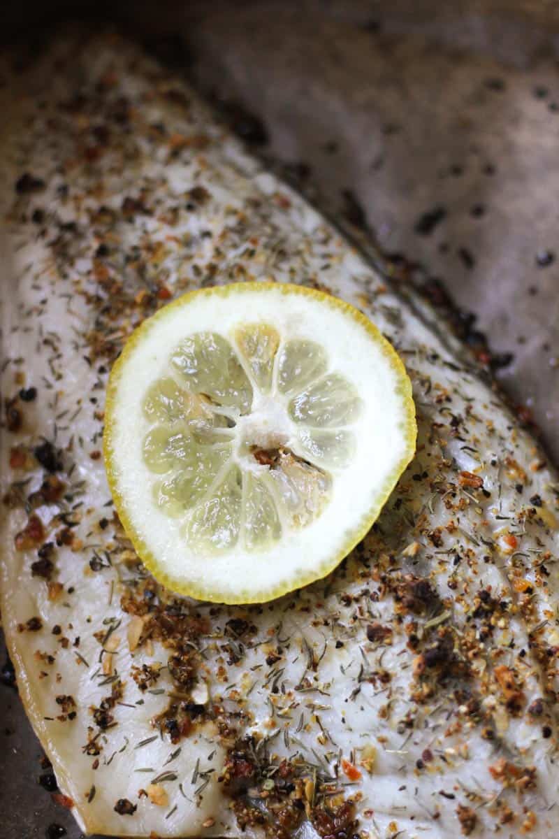 slice of lemon on top of barramundi