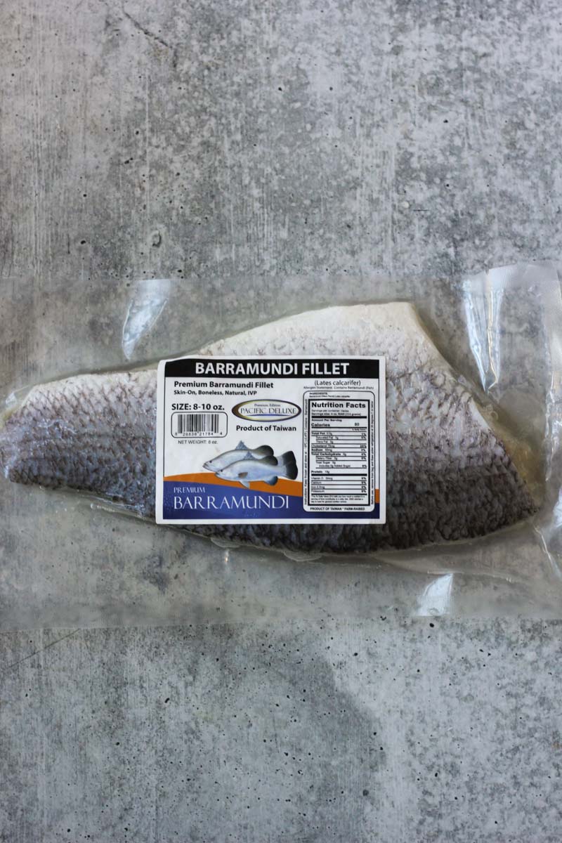 barramundi fillet in the package on the table