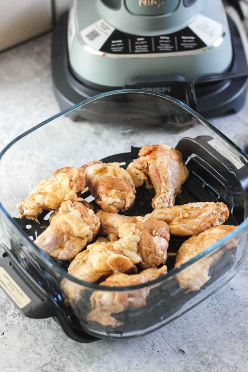 raw chicken wings in ninja crispi before cooking