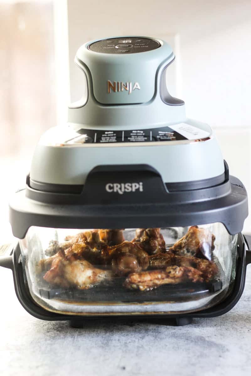 ninja crispi machine with chicken inside