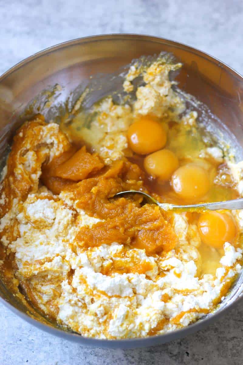 making a batter with pumpkin, eggs and cottage cheese