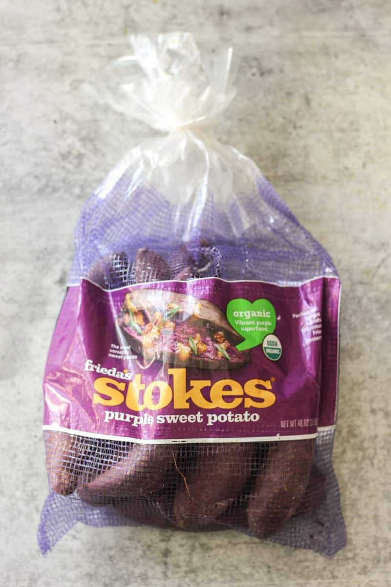 Bag of organic purple sweet potatoes from Stokes, fresh and healthy for cooking or snacking.