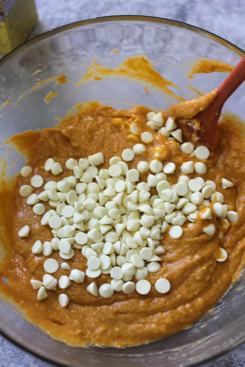 Sweet potato cookie dough with white chocolate chips in a glass bowl.