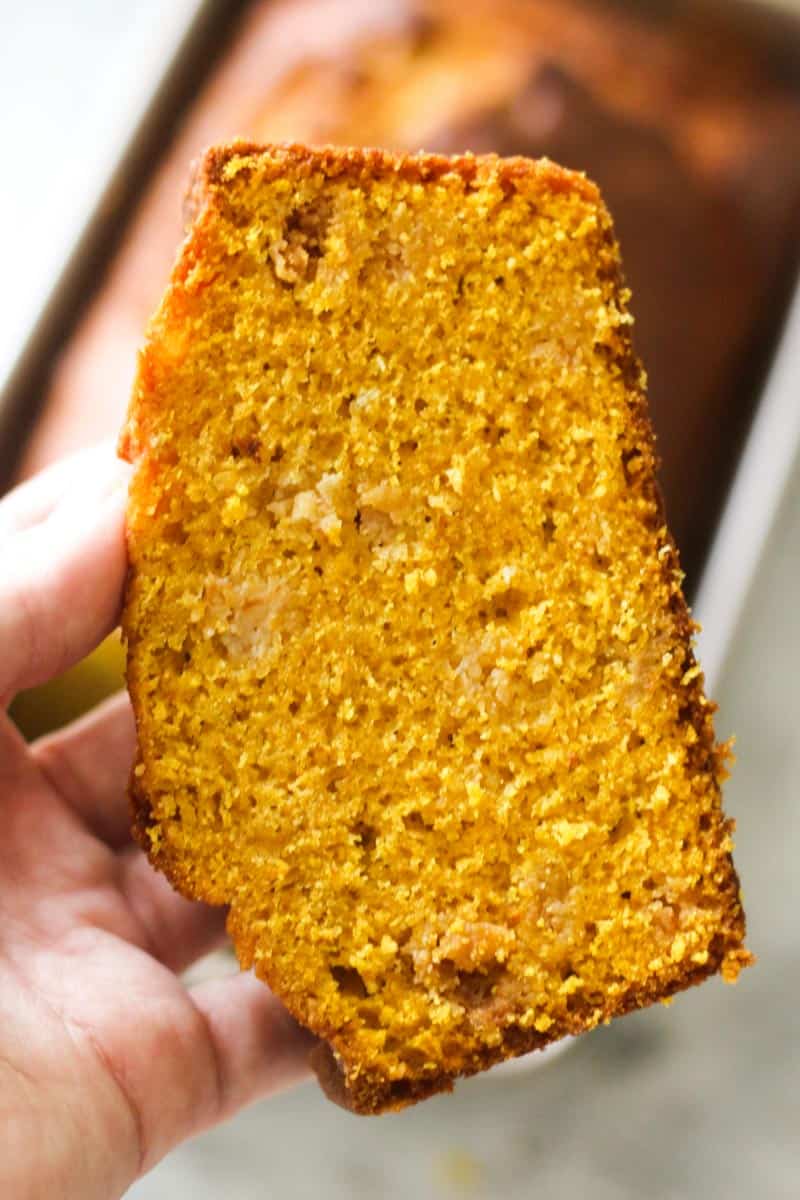 Close-up of a golden cornbread slice with a moist crumb texture.