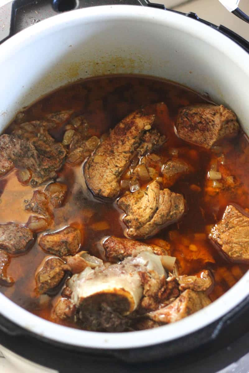 Slow cooker beef stew with tender meat and rich broth.