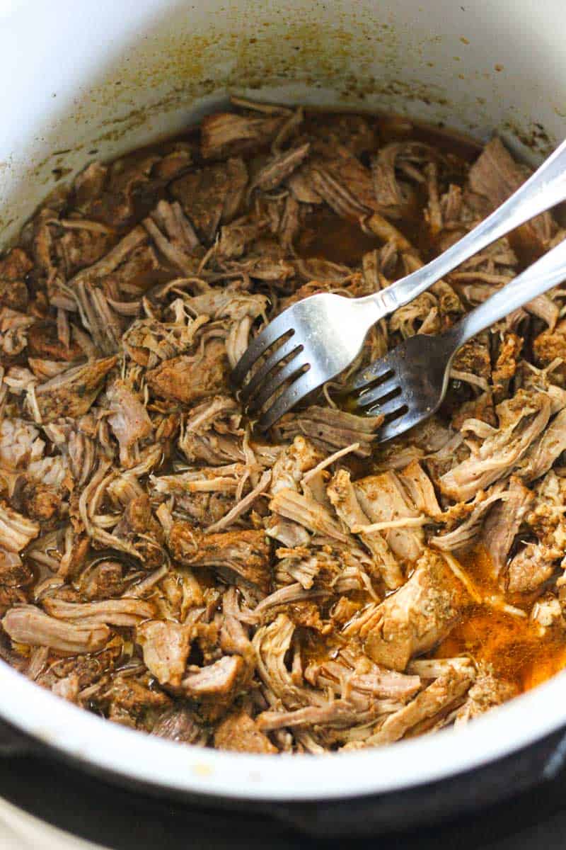 Tender shredded beef in a pot, perfect for sandwiches or tacos.