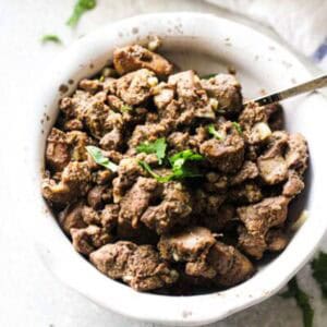 chopped chicken liver in the white bowl